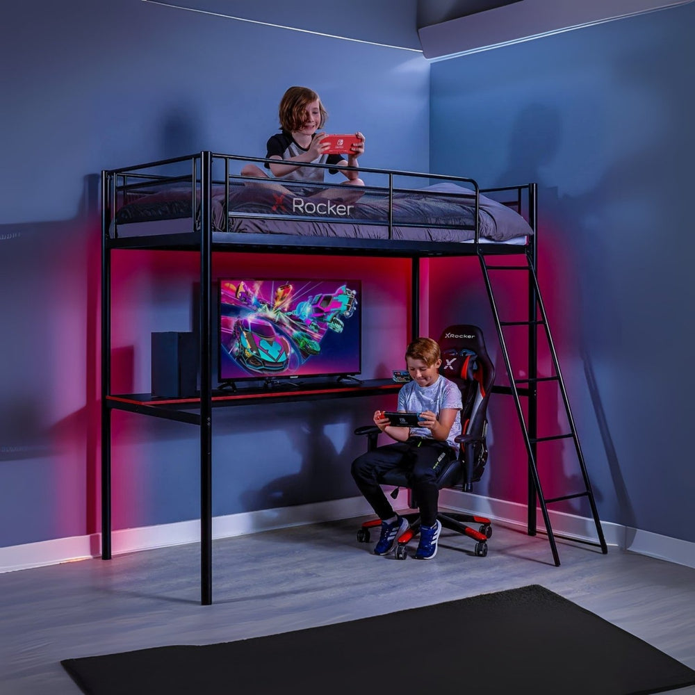 Children playing video games in a room with a bunk bed and gaming setup.