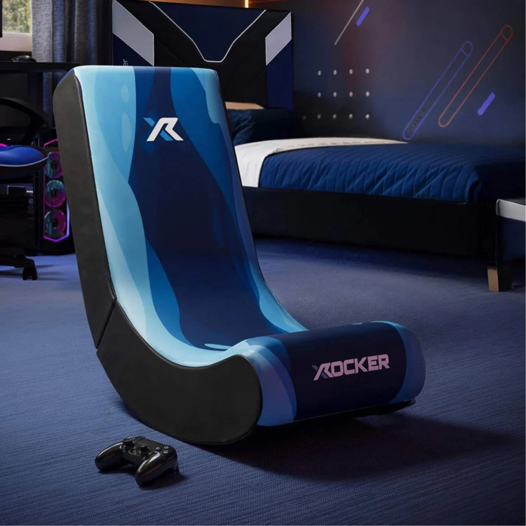 Blue gaming chair for kids with 'X rocker' branding in a room setting.