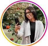 Woman taking a selfie outdoors with a colorful border