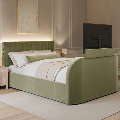 Green upholstered bed in a bedroom setting with neutral decor.