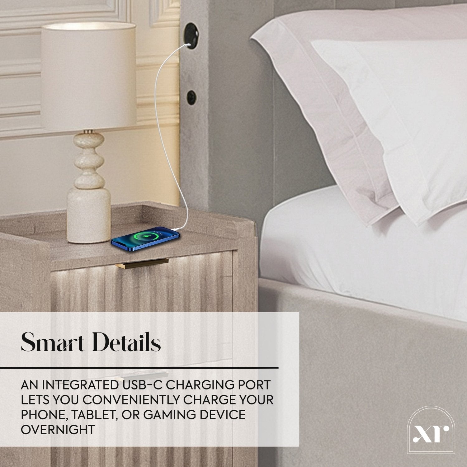 Bedside table with integrated USB-C charging port, lamp, and phone on a nightstand.