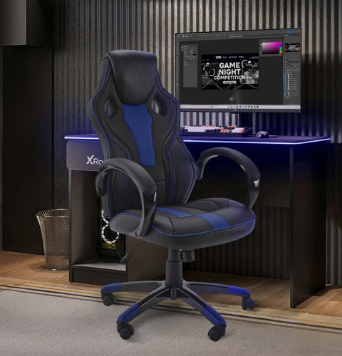 Gaming chair in front of a computer setup on a desk with X Rocker branding.
