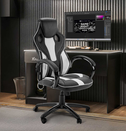 Black and gray gaming chair in front of a computer desk with a monitor displaying a game night theme.