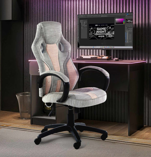 Gray gaming chair in front of a computer desk with a monitor displaying a game night theme.