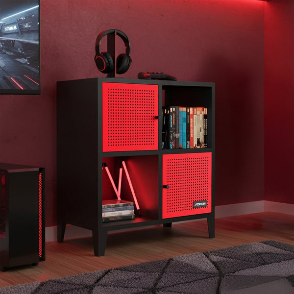 Black and red cube shelf with books and a gaming console in a room with red walls.