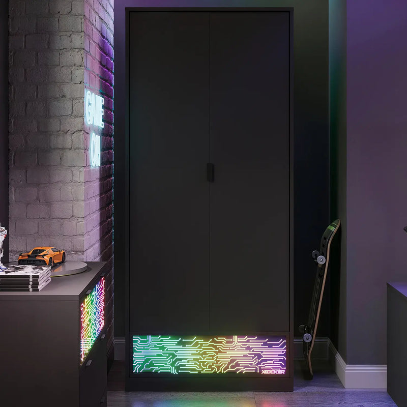 Black wardrobe with colorful LED lighting in a room with a brick wall and skateboard.