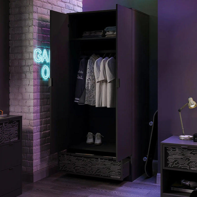 Closet with open doors revealing clothes, neon sign on brick wall, and lamp on nightstand.