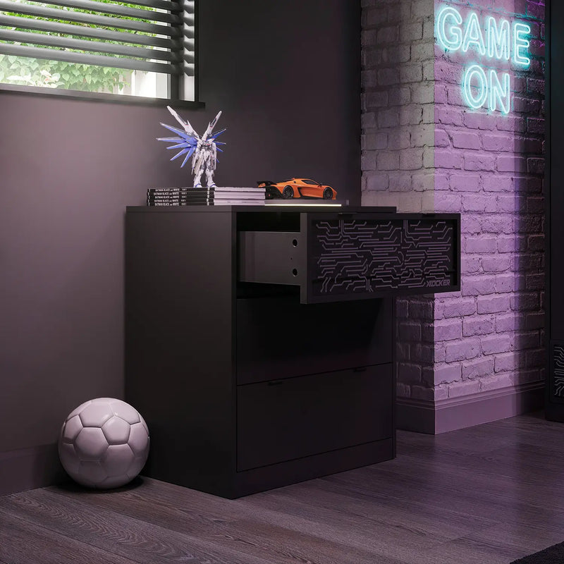 Modern black chest of drawers in a room with a neon 'GAME ON' sign on a brick wall.