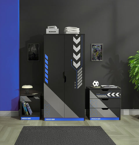 Modern bedroom furniture set with cabinets and drawers in a room with a dark wall and plant.
