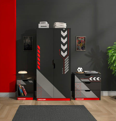 Black and red furniture set with 'X rocker' branding in a room with a red wall and gray floor.