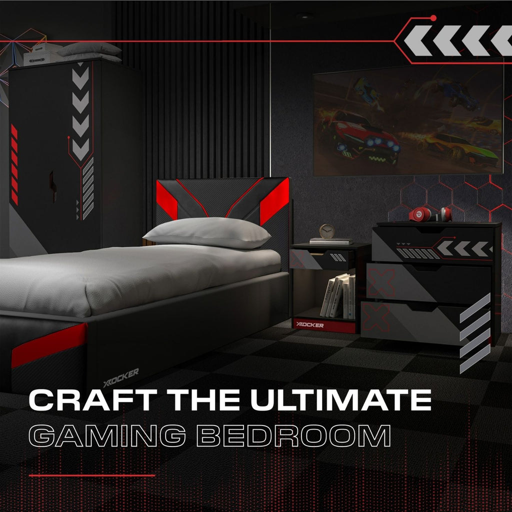 Gaming bedroom setup with bed, nightstands, and wall art in a dark theme with red accents.