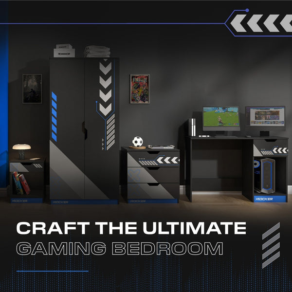 Gaming bedroom setup with desk, monitors, and wardrobe with chevron design.