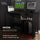 Gaming desk with multiple monitors and a computer tower, suitable for gaming setups.