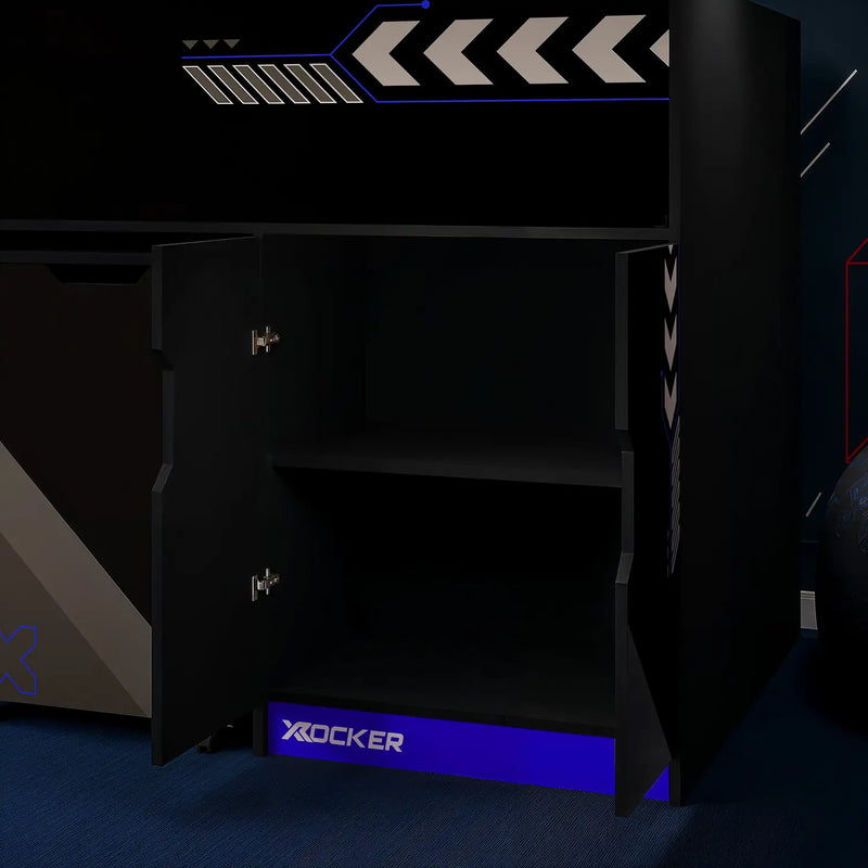 Black gaming bed with X rocker logo in a dark room, showing an open cupboard