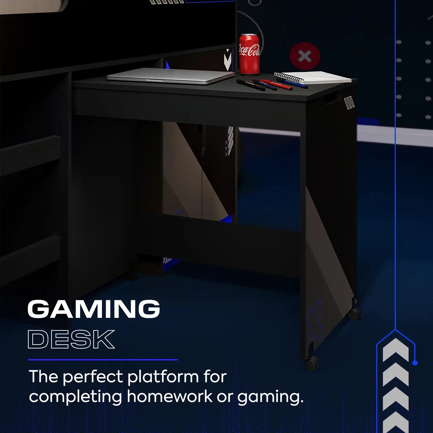 Gaming desk with laptop, Coca-Cola can, and other items on a dark background