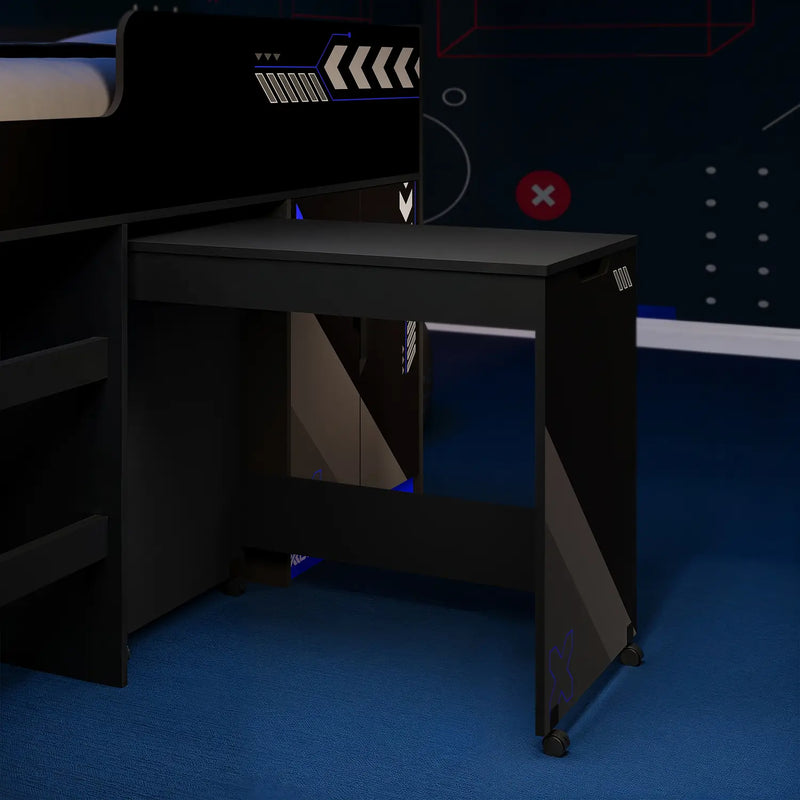 Black gaming desk with a computer monitor in a dark room