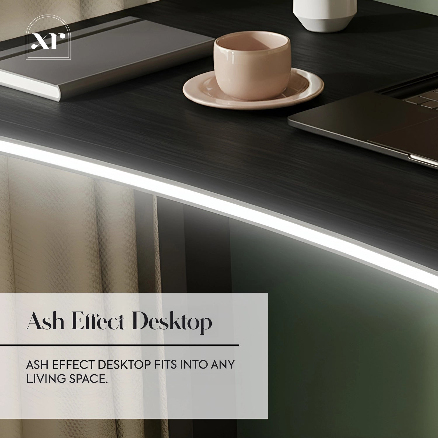 Modern desk with ash effect surface, laptop, and cup on a blurred background