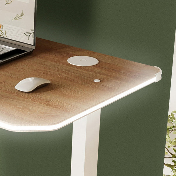 Wooden desk with two computer mice on a green wall background