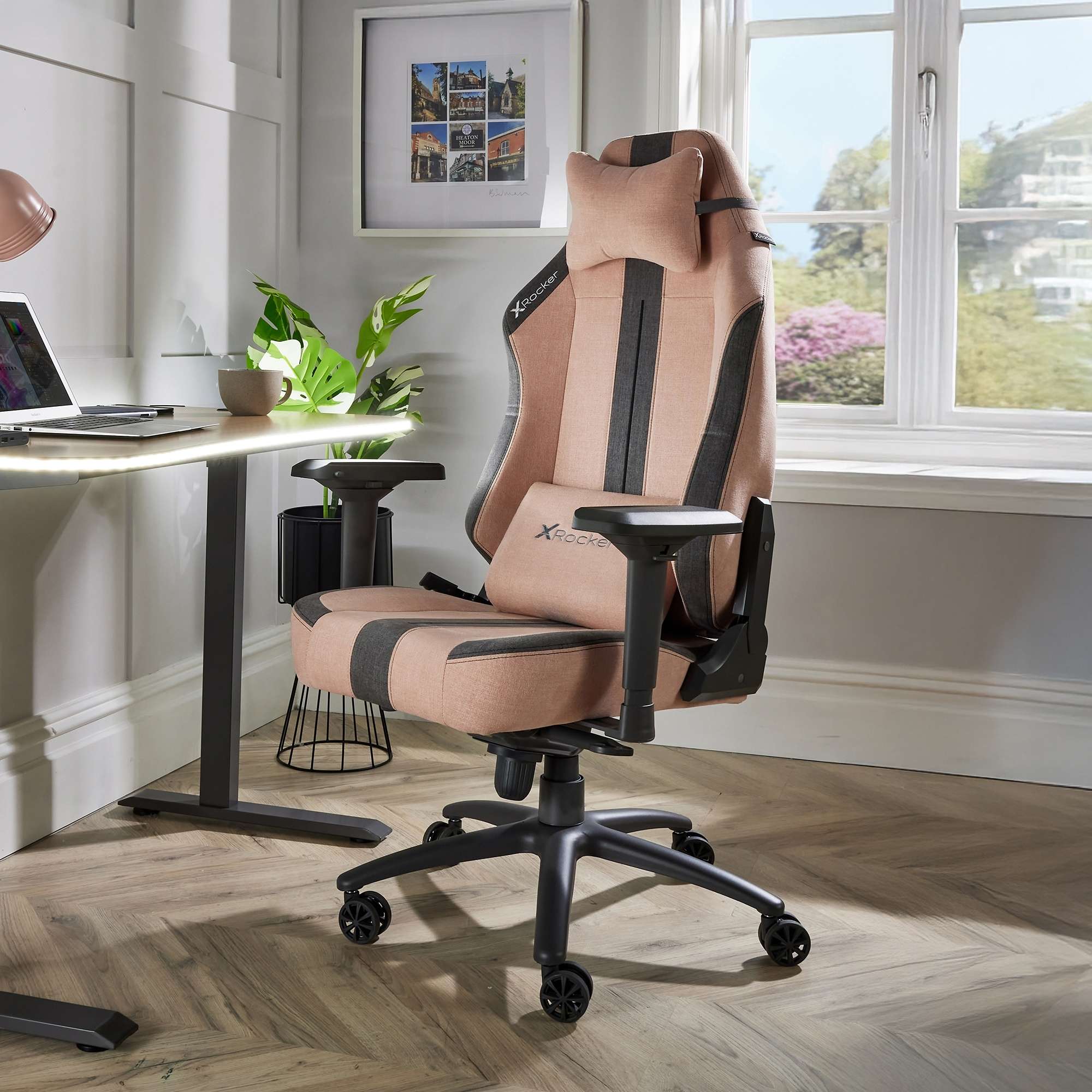 Beige and black office chair in a room with a desk and window.