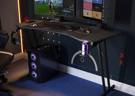 Panther Gaming Desk setup with dual monitors in a dark room