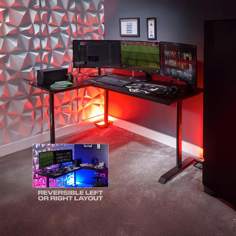 Gaming desk setup with multiple monitors and gaming equipment against a textured wall.