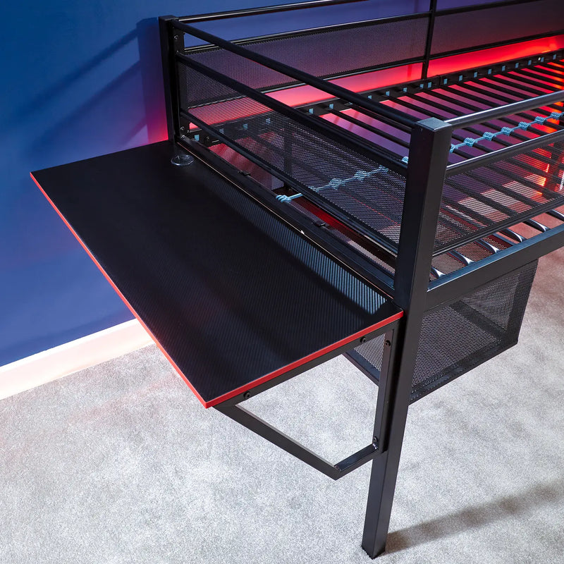 Gaming desk with mesh side panels and red accents on a gray surface.