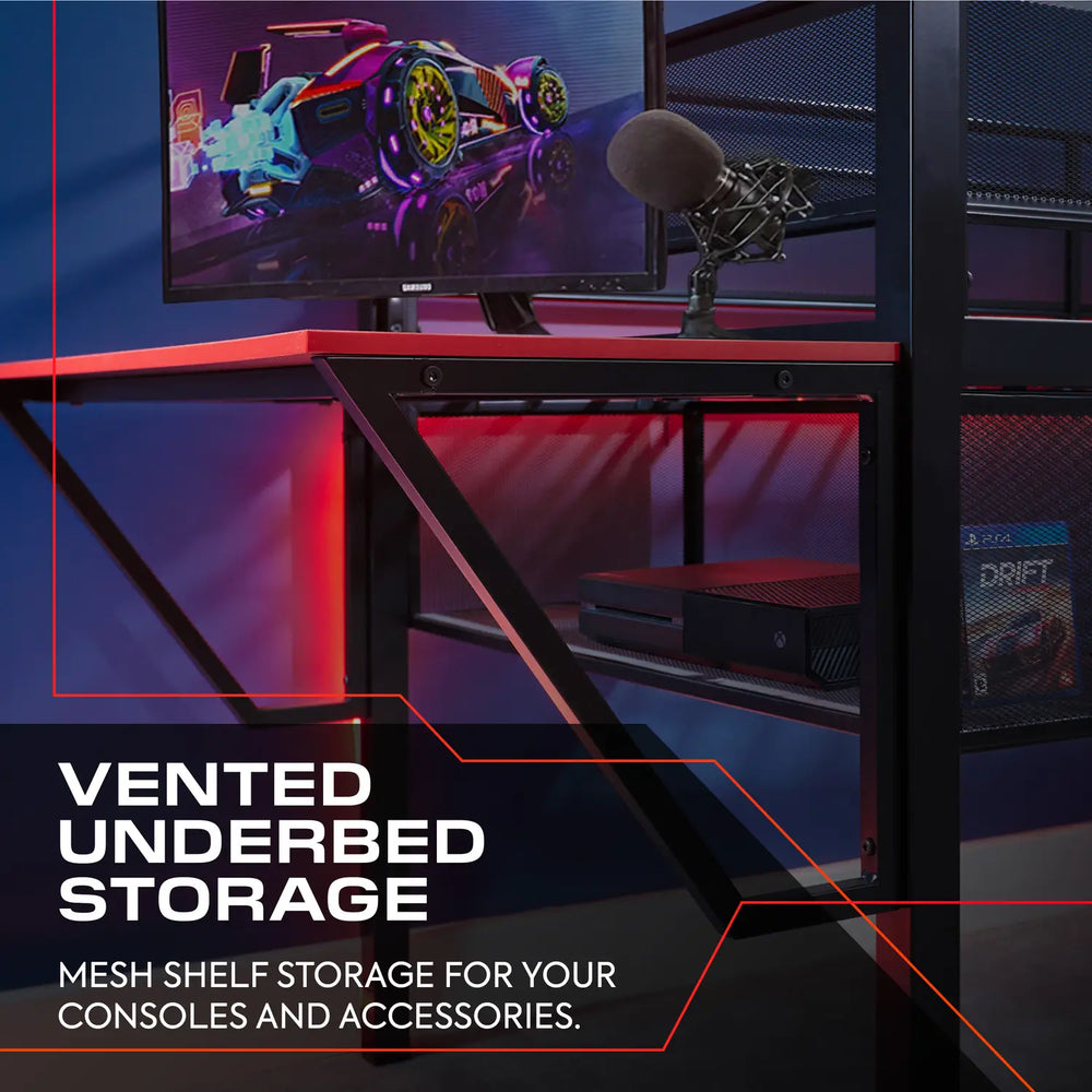 Gaming desk setup with monitor, microphone, and gaming console, featuring text about vented underbed storage.
