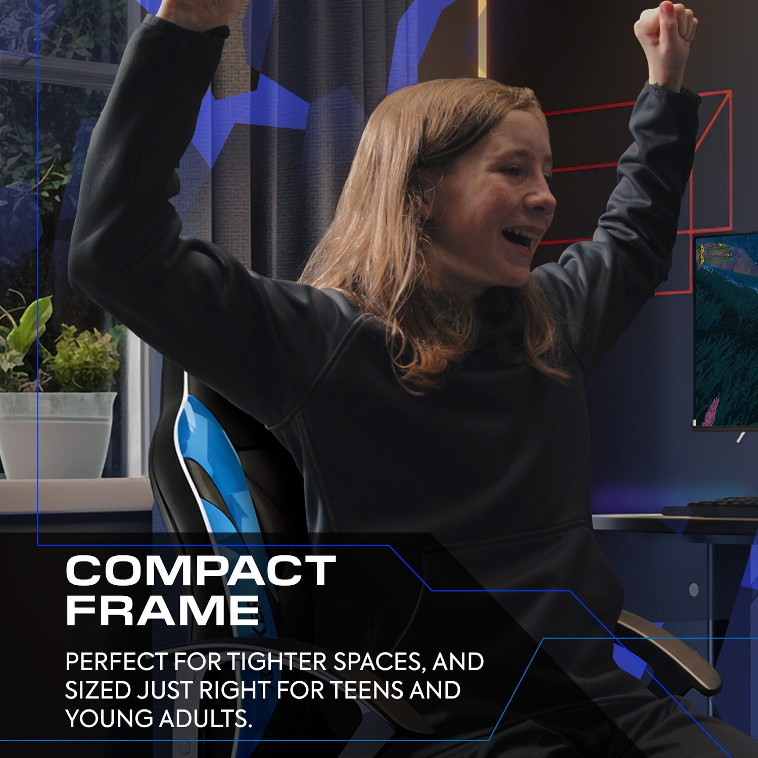 Person sitting in a gaming chair with arms raised in a room setup for gaming or work.