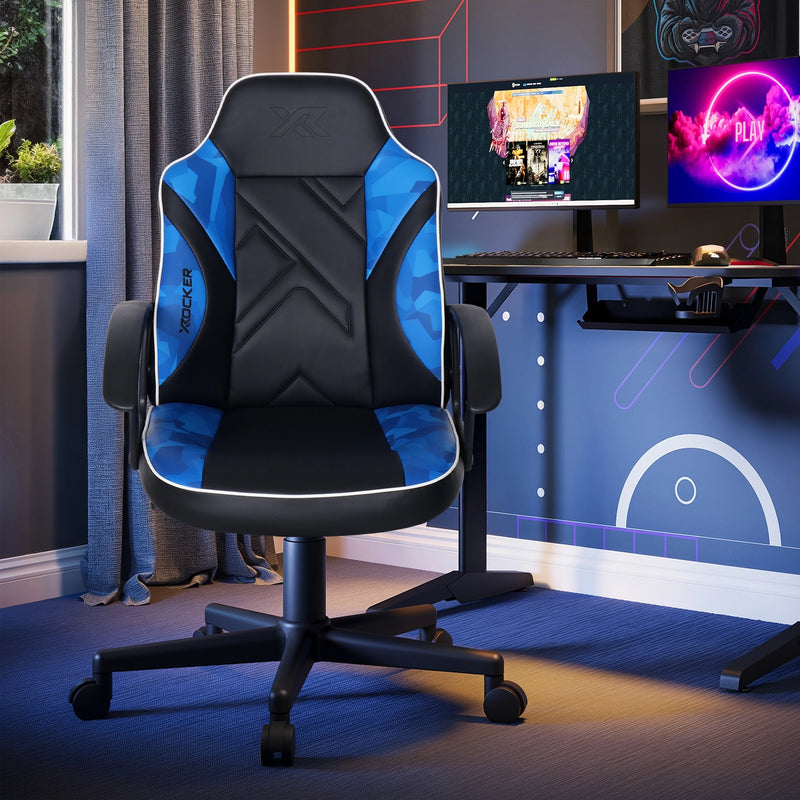 Gaming chair in a room with computer setup and colorful lights