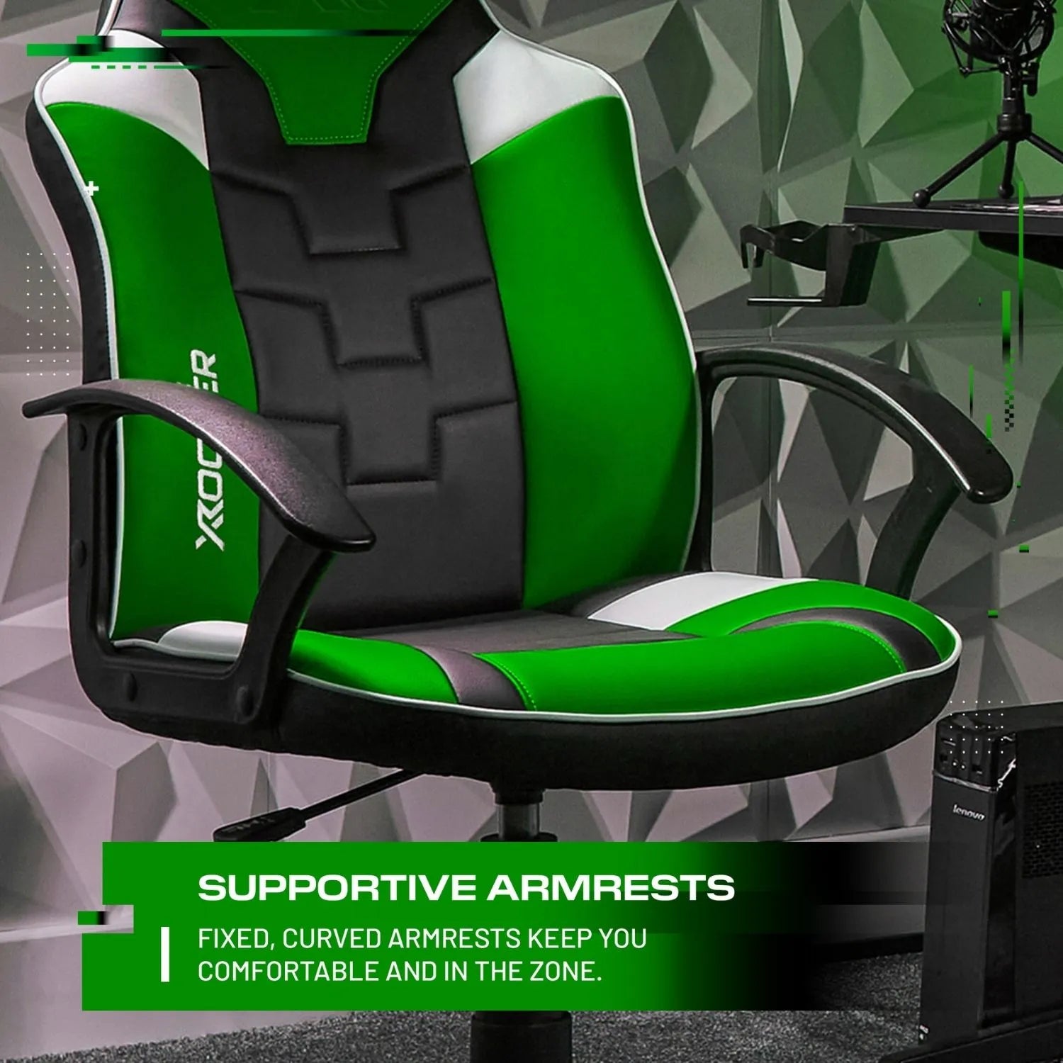 Green and black gaming chair with supportive armrests in a room setup.