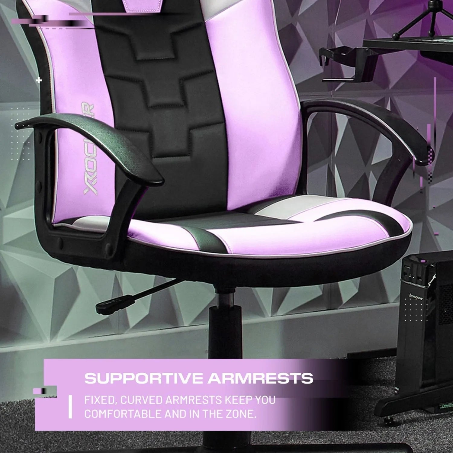 Gaming chair with pink and black design in a modern room setting