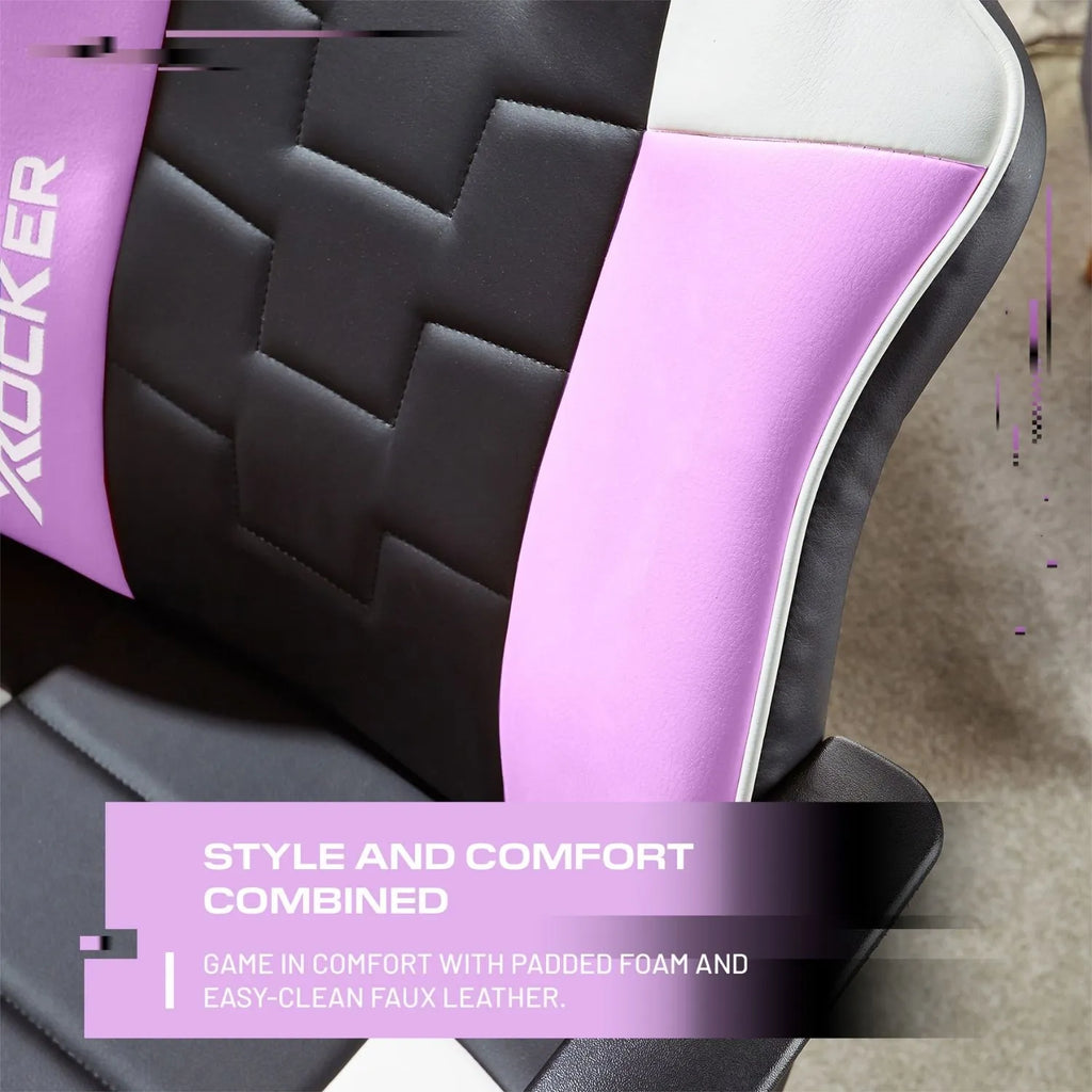 Close-up of a gaming chair with pink and black design, featuring the brand 'X Rocker'.