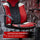 Red and black gaming chair with supportive armrests on a geometric patterned background