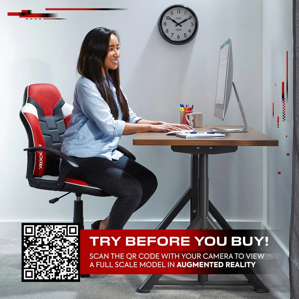 Woman sitting at a desk with a computer, surrounded by office furniture and decor.