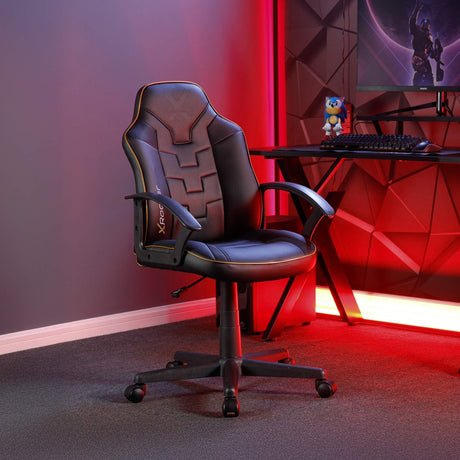 Gaming chair in a room with red lighting and a computer setup.