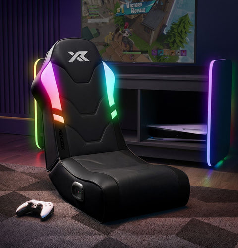 Gaming chair with RGB lighting in a room with a TV displaying a game.