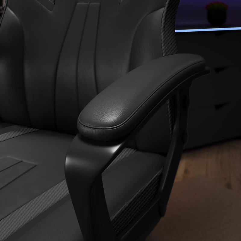 Close-up of a black office chair armrest with a blurred background
