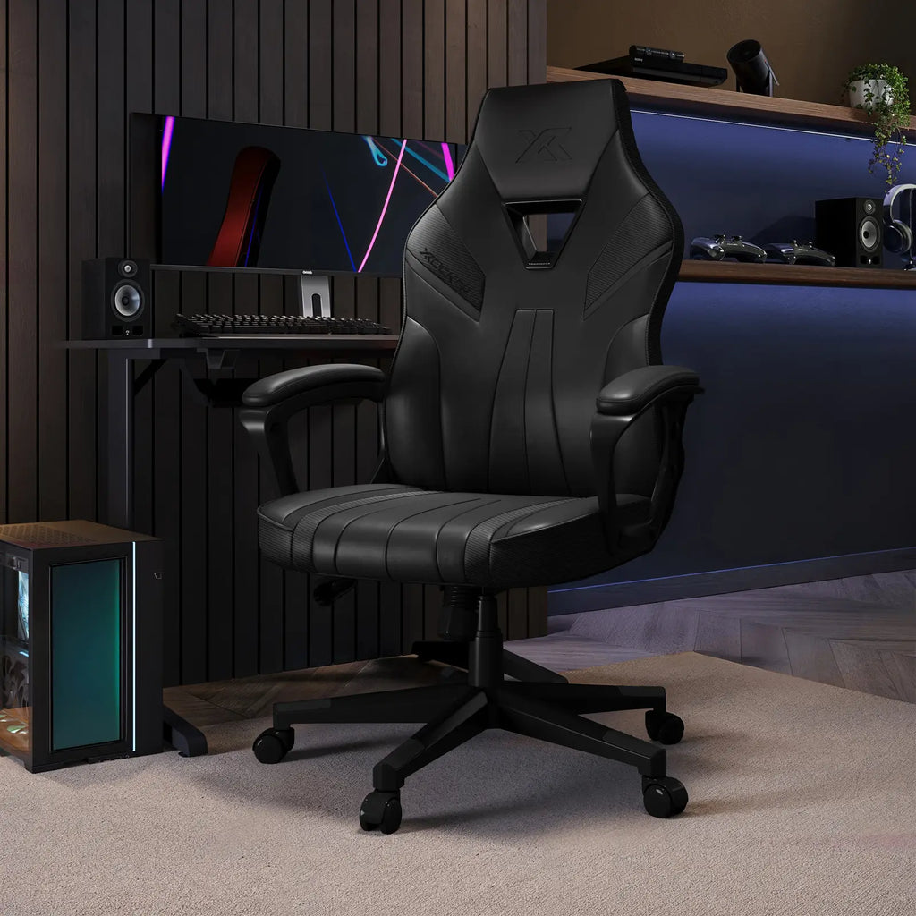 Tempest Black gaming chair in a room with computer equipment