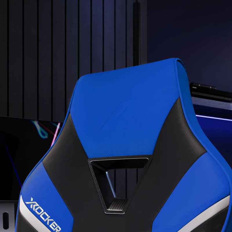Blue and black X rocker gaming chair in a room setting.