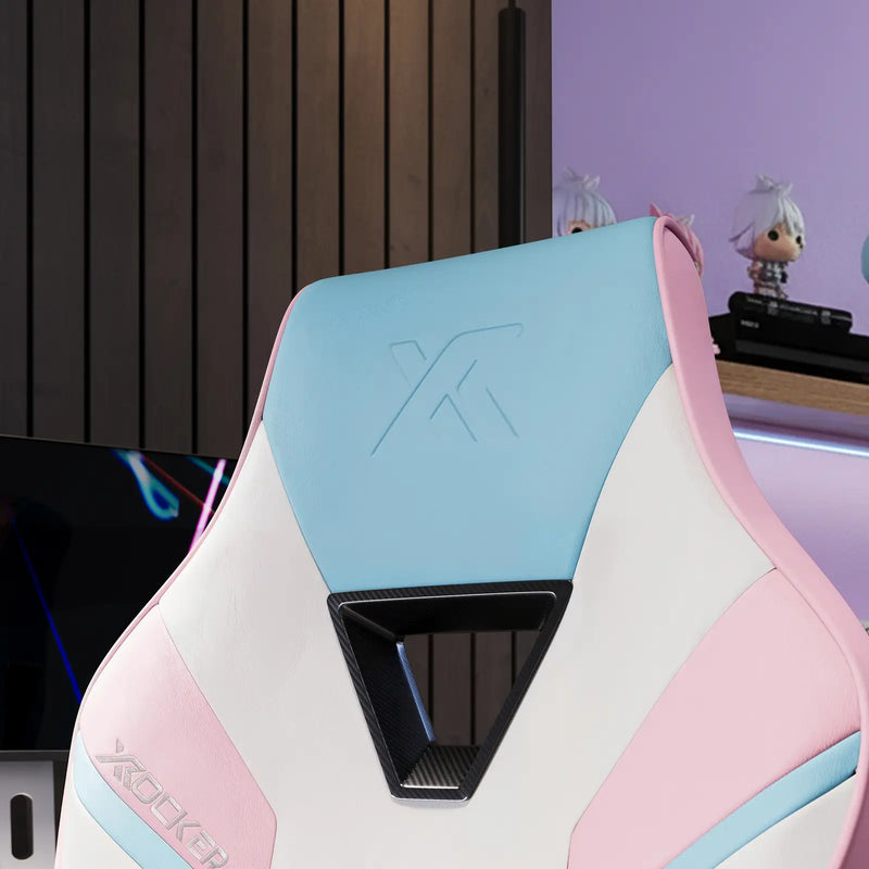 Gaming chair with pastel blue and pink design, featuring a logo on a blurred background.