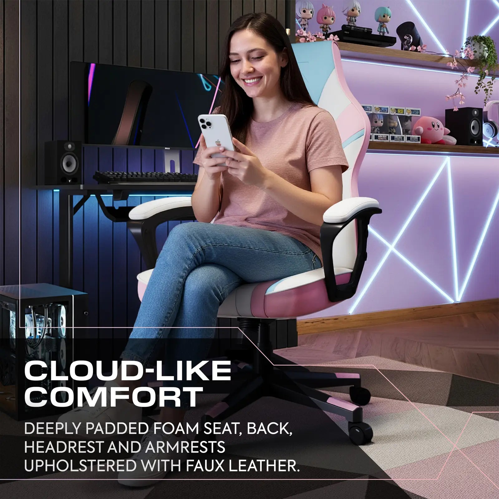 Woman sitting on a gaming chair in a room with gaming setup, using a phone.