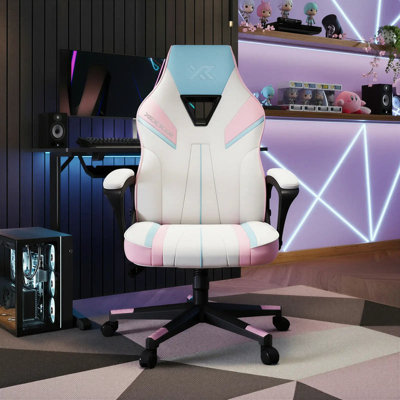 Gaming chair with pink and blue accents in a room with neon lights and toys.