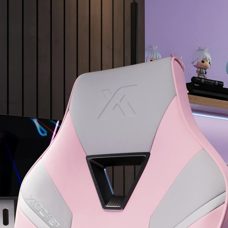 Pink and gray gaming chair with 'X Rocker' logo in a gaming room setting for women