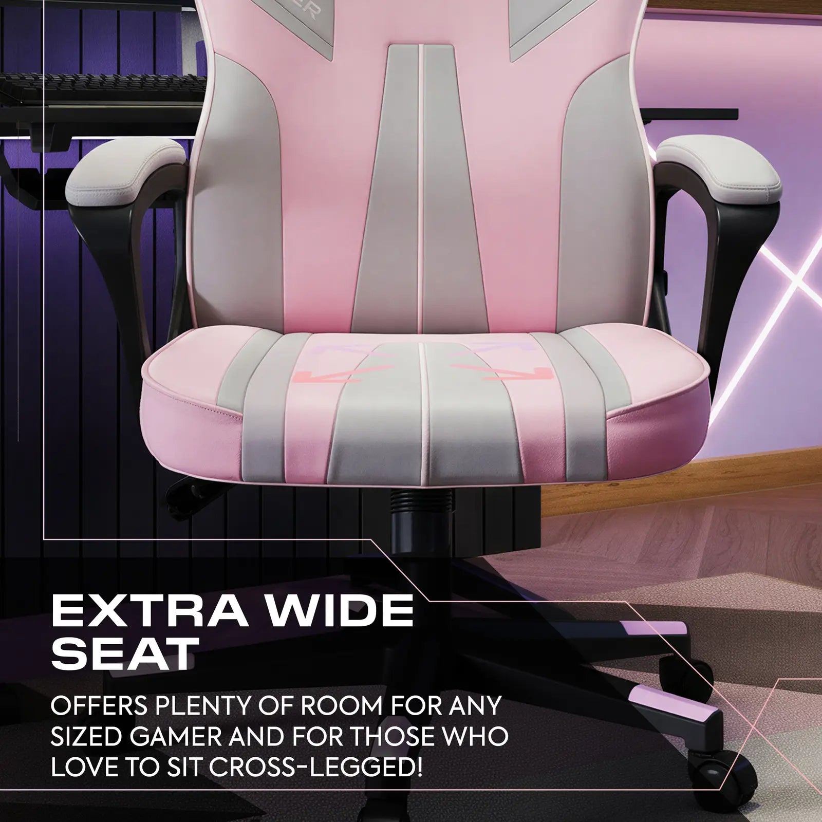 Pink and gray gaming chair with text highlighting its wide seat feature.