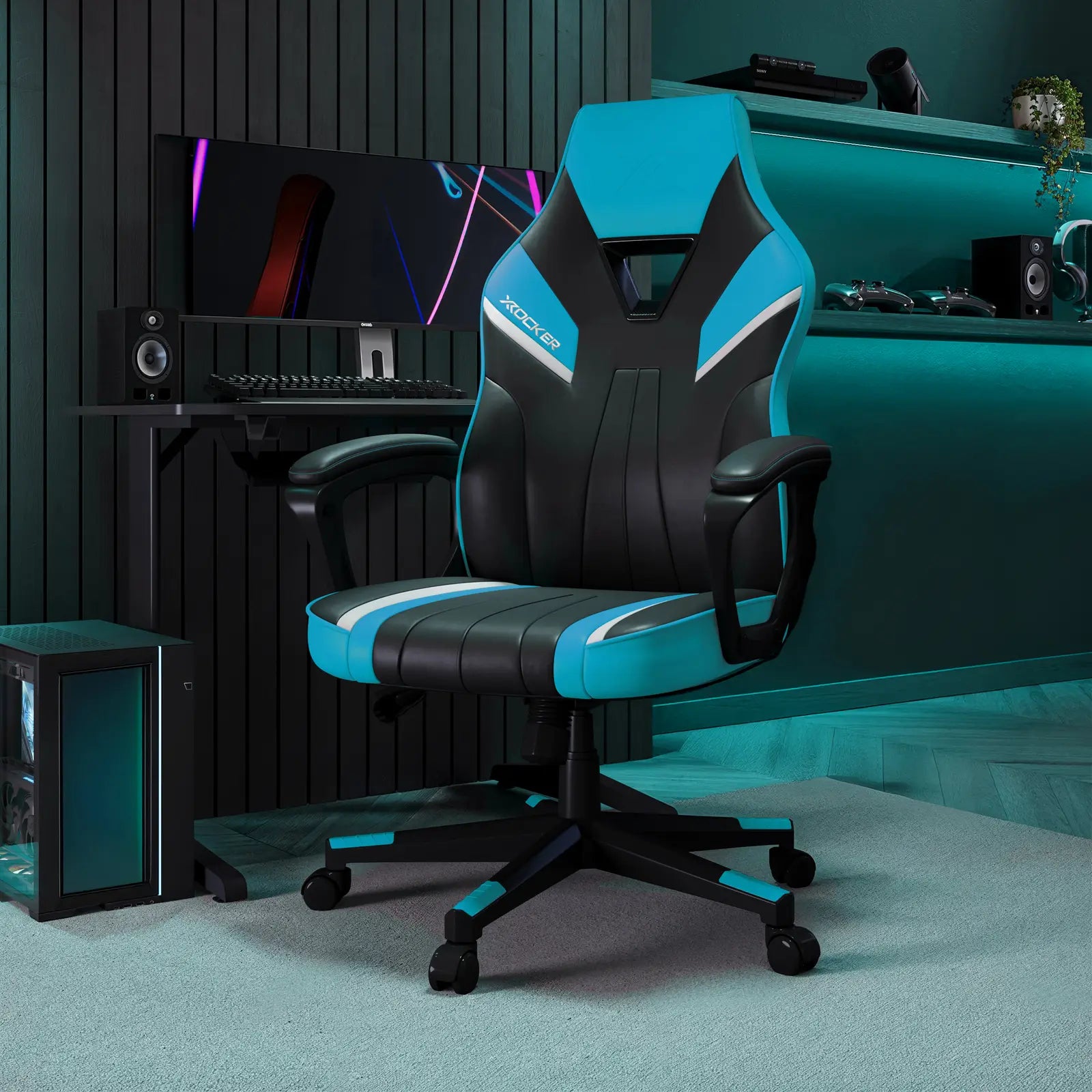 Gaming chair with black and blue design in a room setup with computer equipment.
