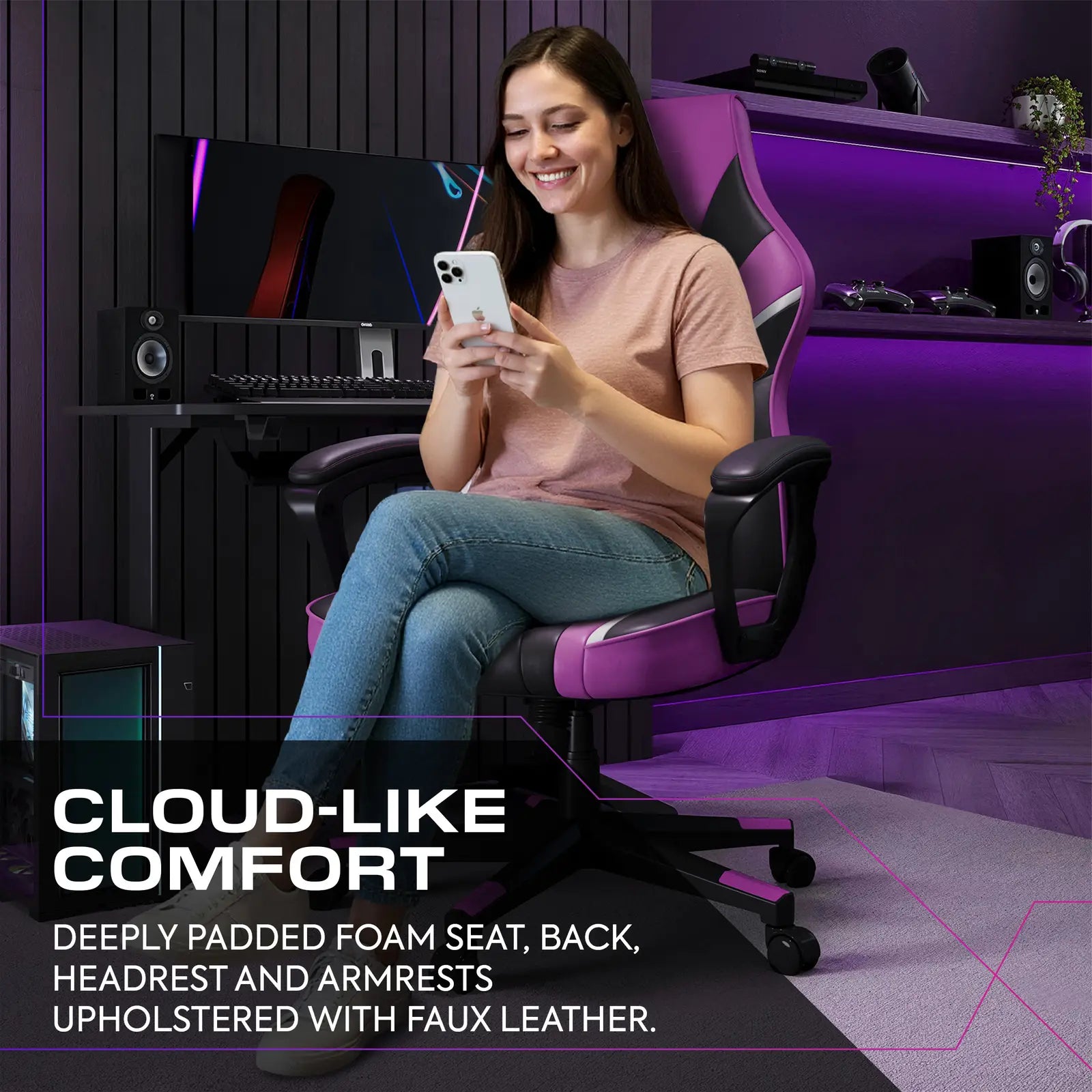 Woman sitting in a gaming chair using a phone in a room with gaming setup.