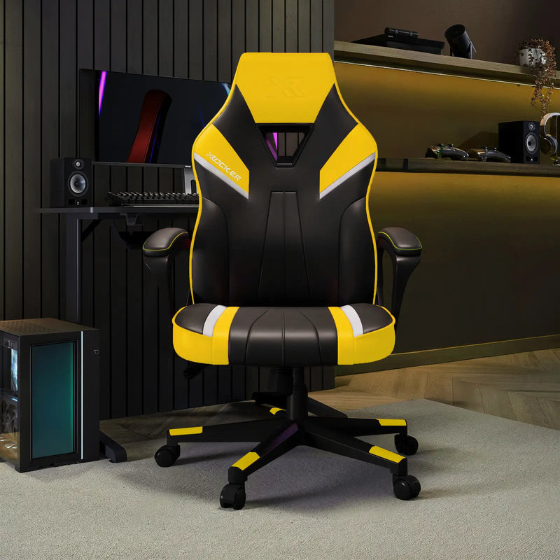 Black and yellow gaming chair in a room with computer equipment.