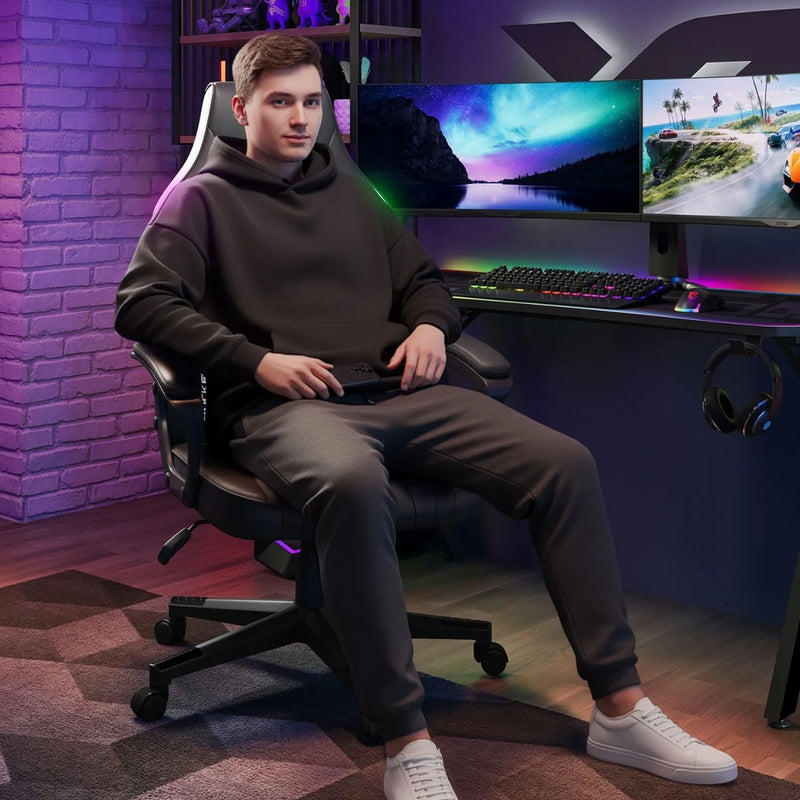 Person sitting in a gaming chair in front of a computer setup with multiple monitors.
