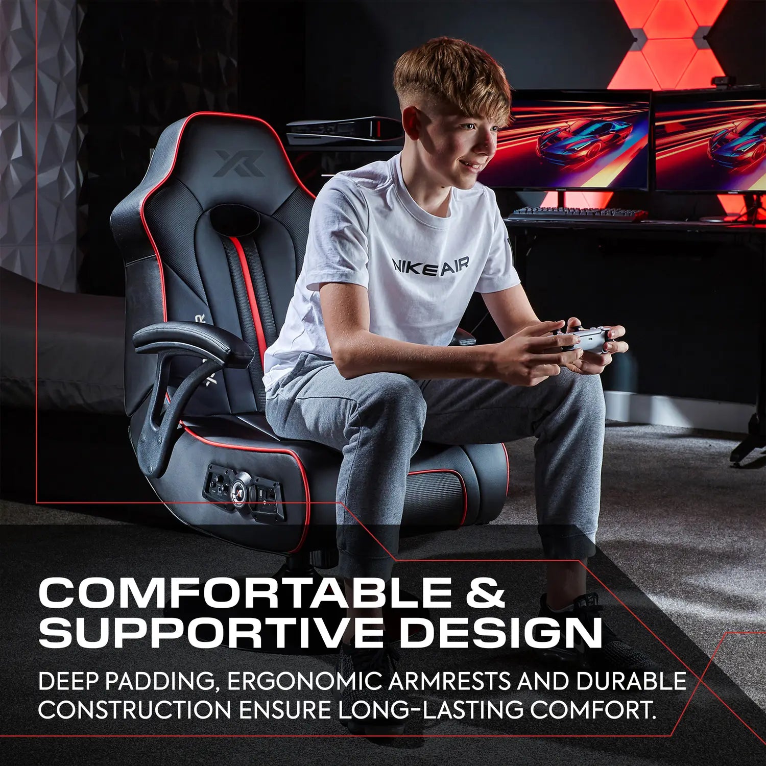 Person sitting on a X Rocker gaming chair with text highlighting comfort and support.