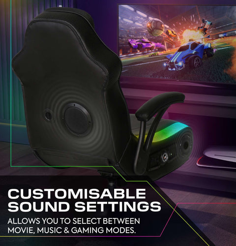 Gaming chair with customizable sound settings in a room with a TV displaying a racing game.